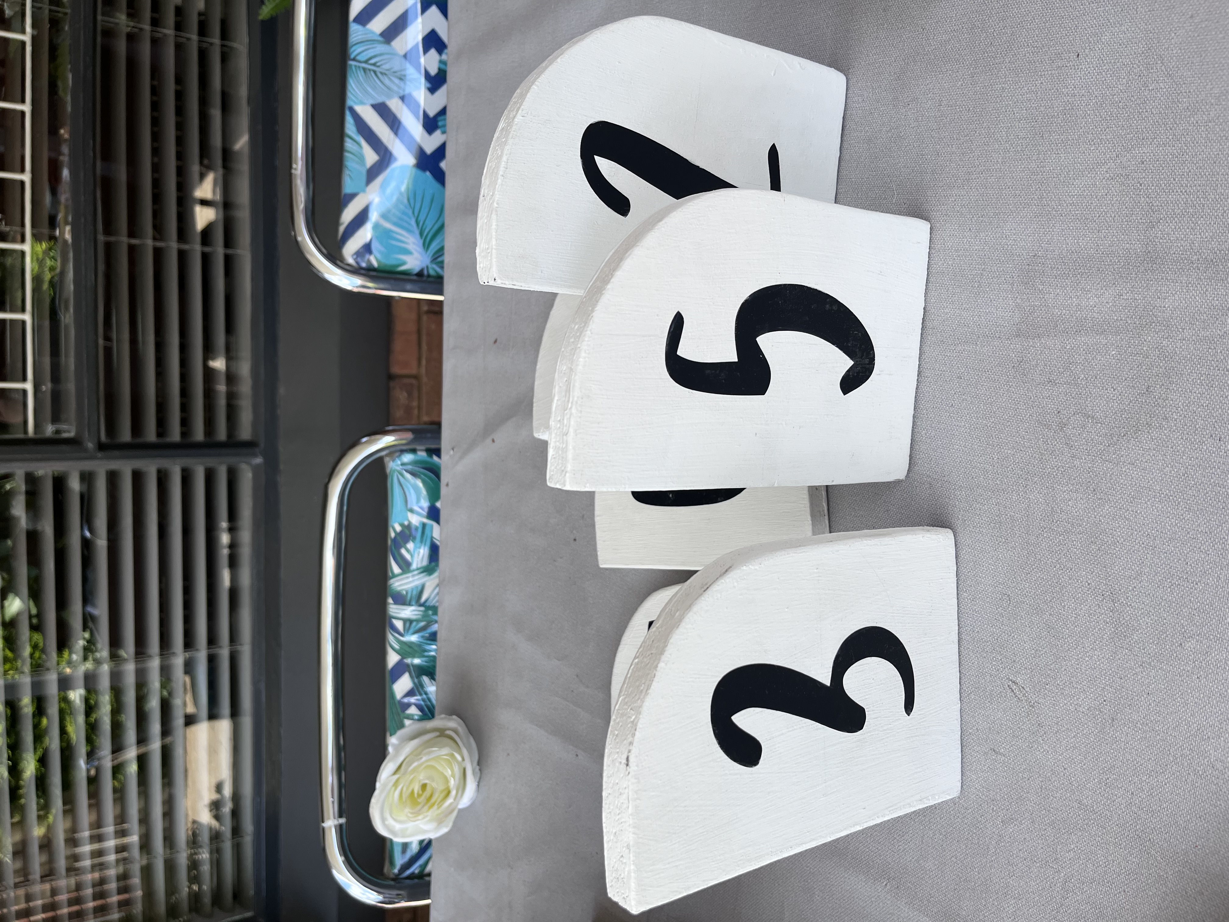 6 White table numbers. Stickers are removable. 