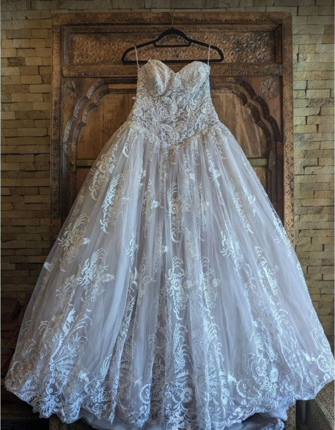Lace bridal gown with pink blush undertones 